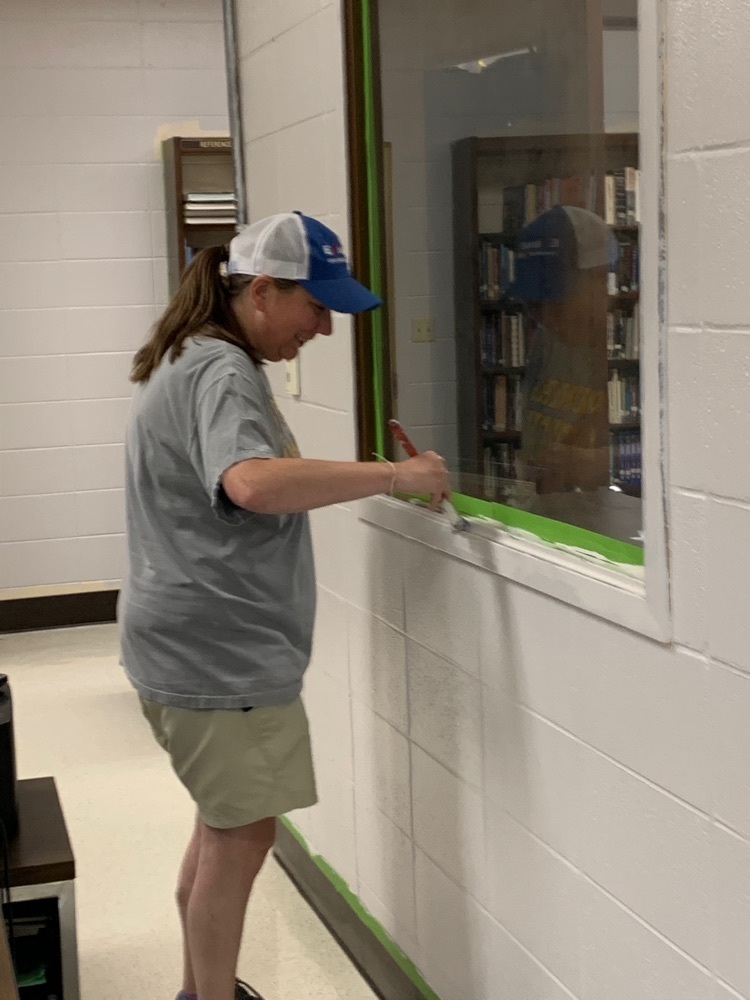 Library media specialist Jennifer Cherry putting that special touch on the library 
