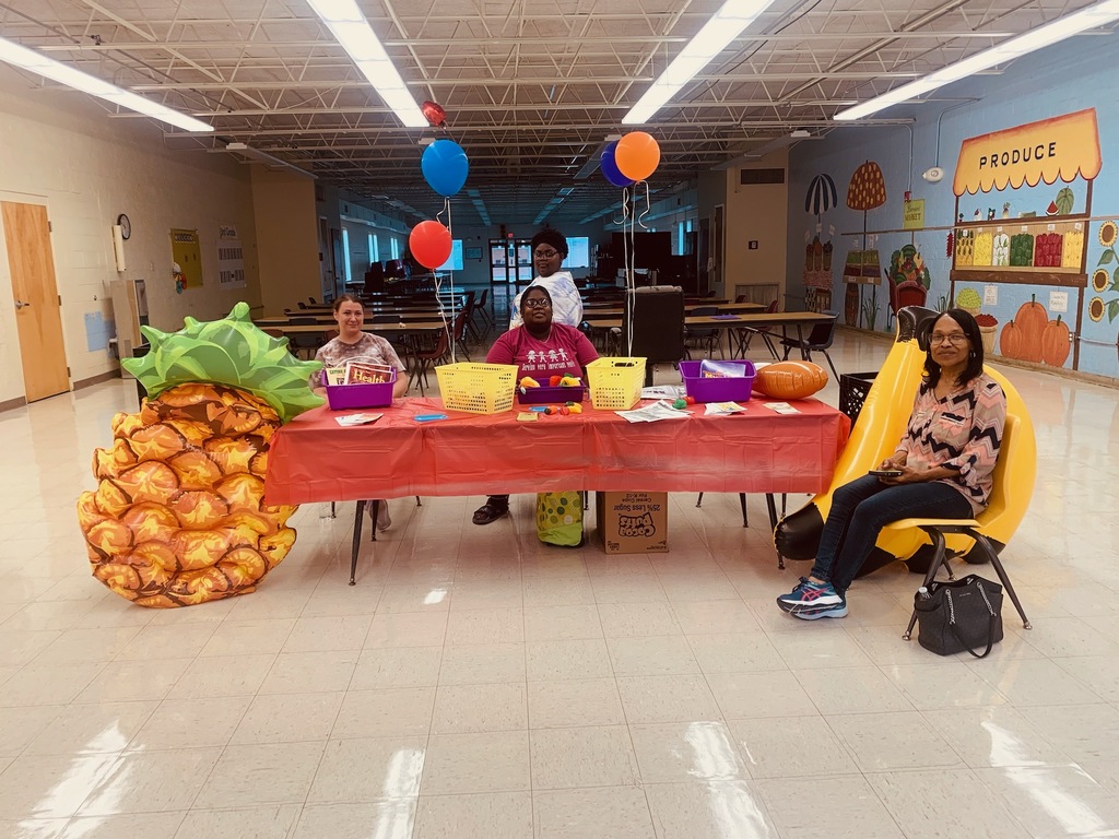table in cafeteria with pineapple blow up