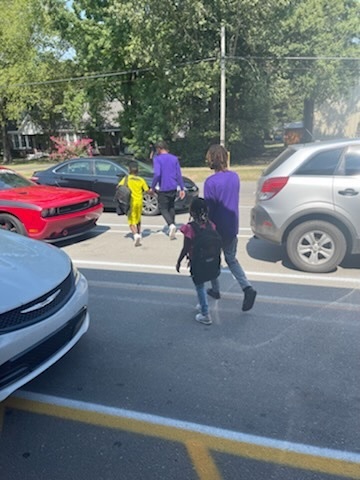 Senior Bobcats helping Baby Bobcats to car