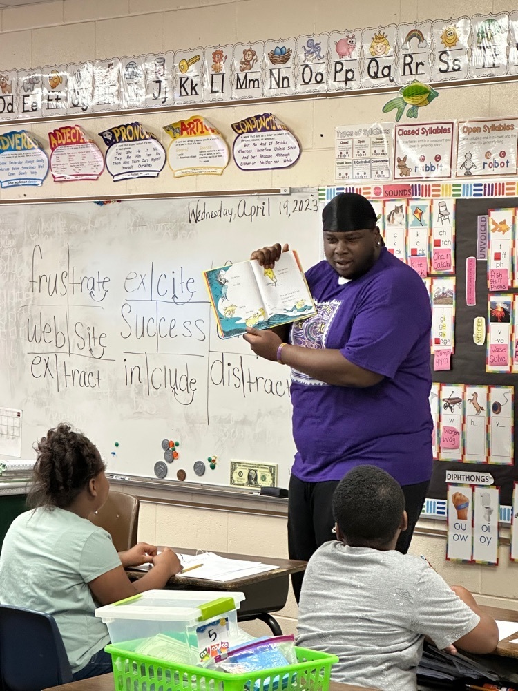 College Student Reading to Students  